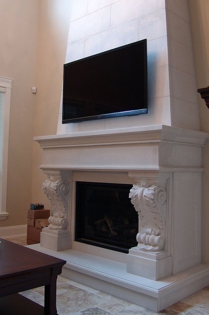 Limestone fireplace mantel with over mantel